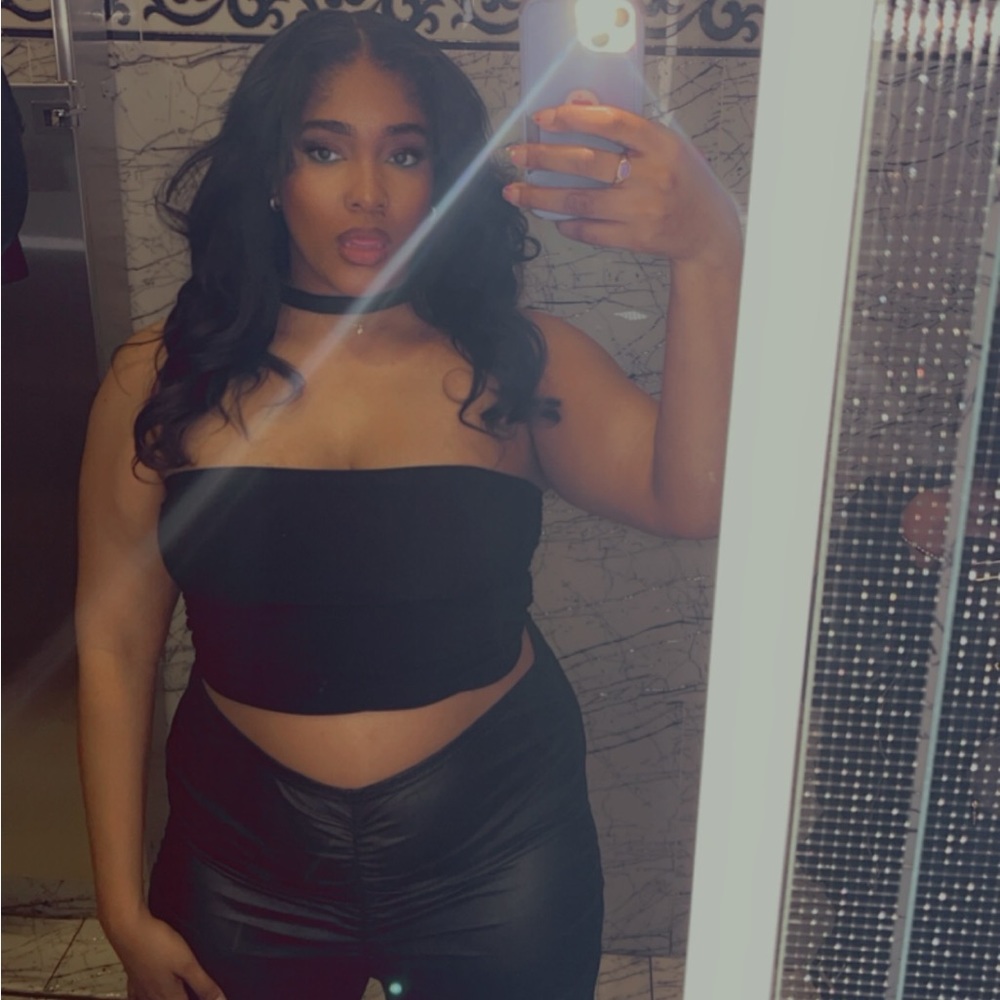 Black body suit, worn and photographed well